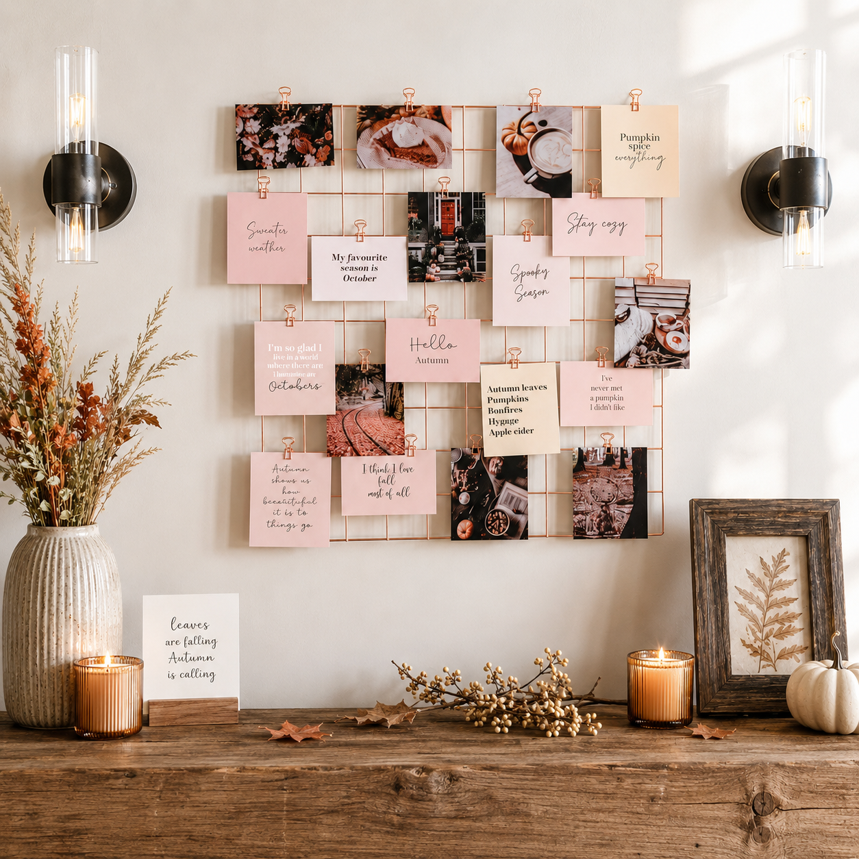 Autumn vision board mounted above console table with candles and dried florals