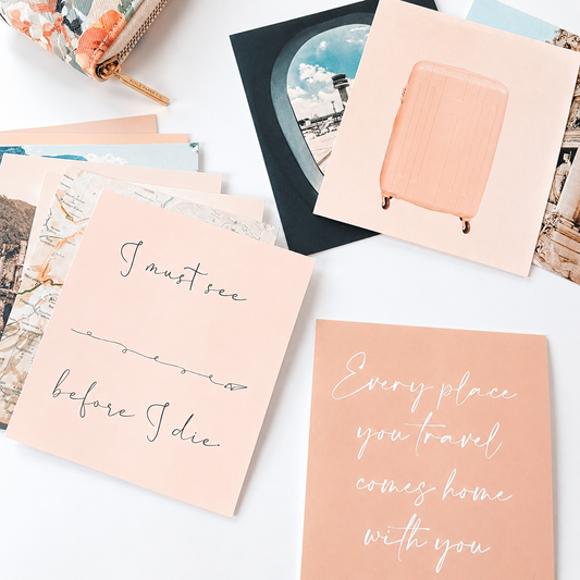 Travel vision board cards spread out on table.