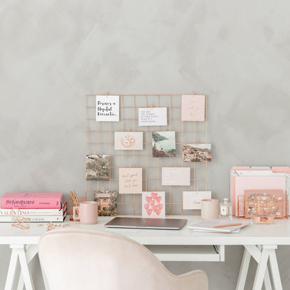 Vision board starter kit with rose gold grid, clips, affirmation cards, and notepad