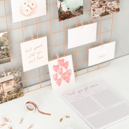 Vision board cards styled with laptop and desk decor