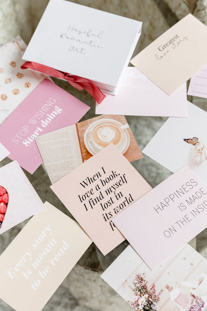 Aesthetic vision board cards displayed on a bright desk with a rose gold grid