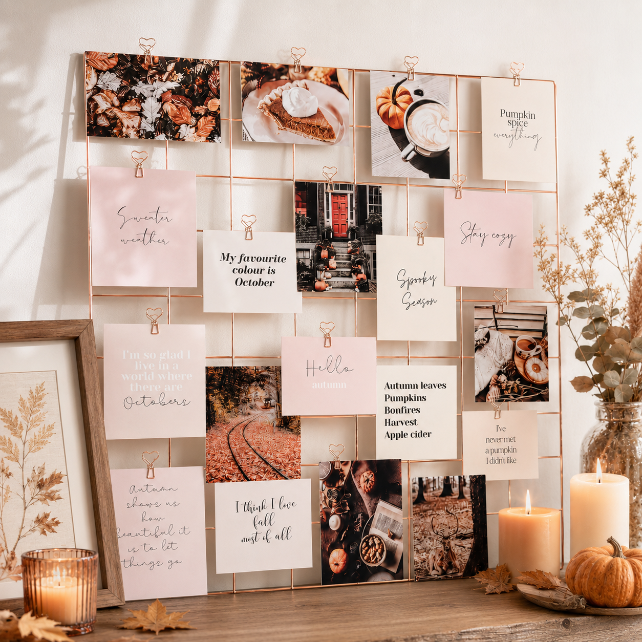 Autumn vision board with pumpkin spice and sweater weather cards beside pillar candles