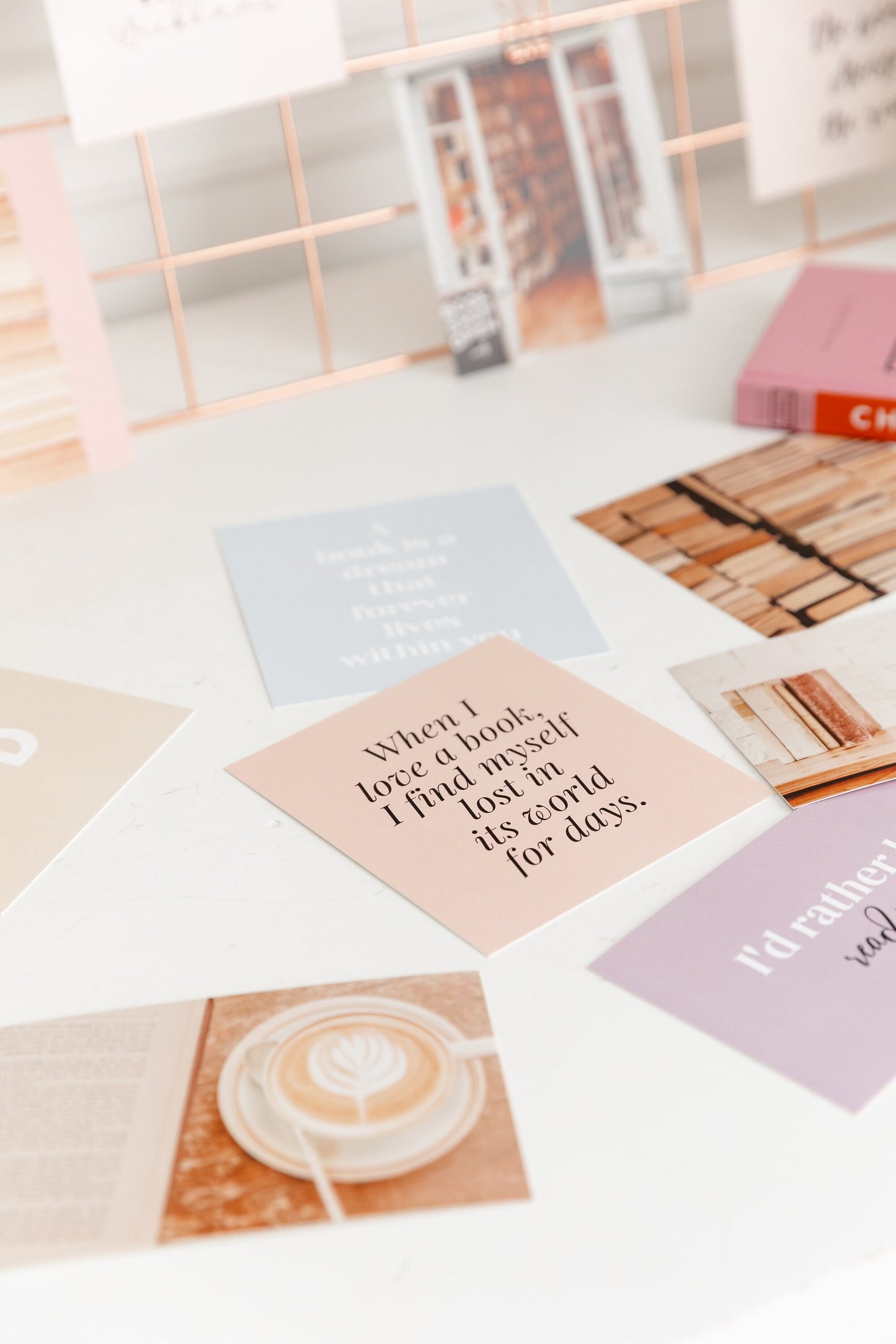 Bookish vision board cards arranged in a flatlay with reading-inspired image cards