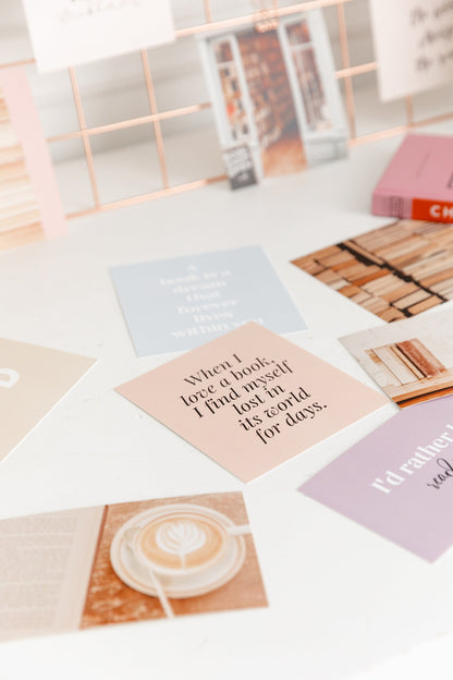 Bookish vision board cards arranged in a flatlay with reading-inspired image cards