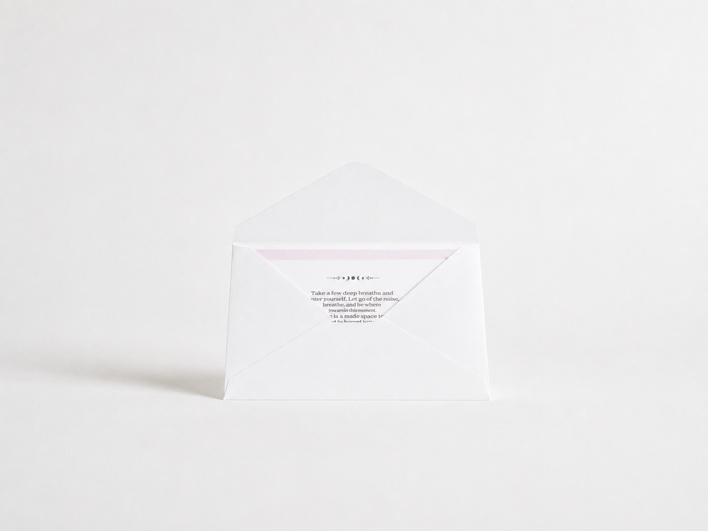 Side view of a flat oracle card reading envelope showing its slim shape