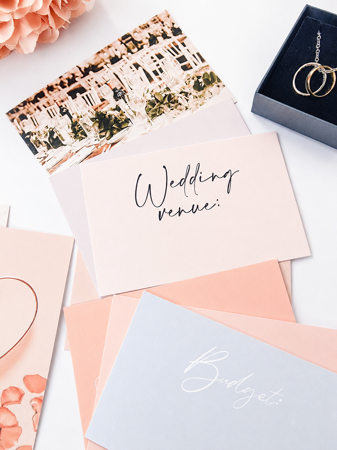 Wedding vision board cards flatlay with rings
