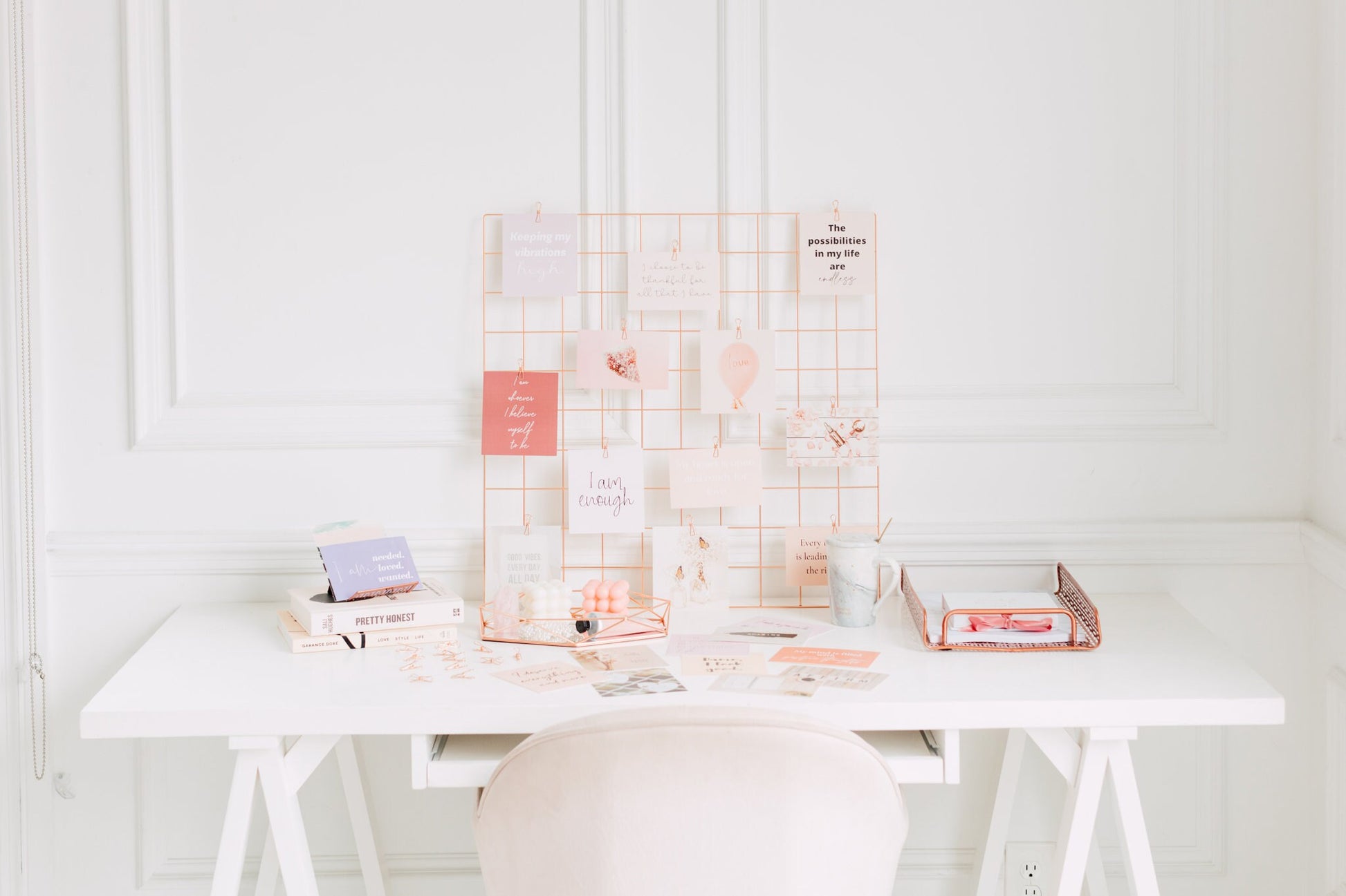 Manifestation cards arranged for a vision board with dreamy quote and image cards