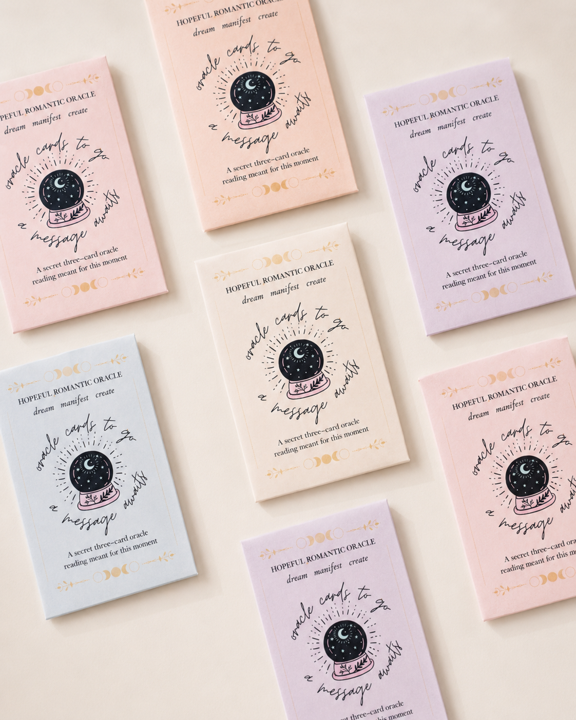 Pastel mini oracle card reading envelopes arranged on a clean background