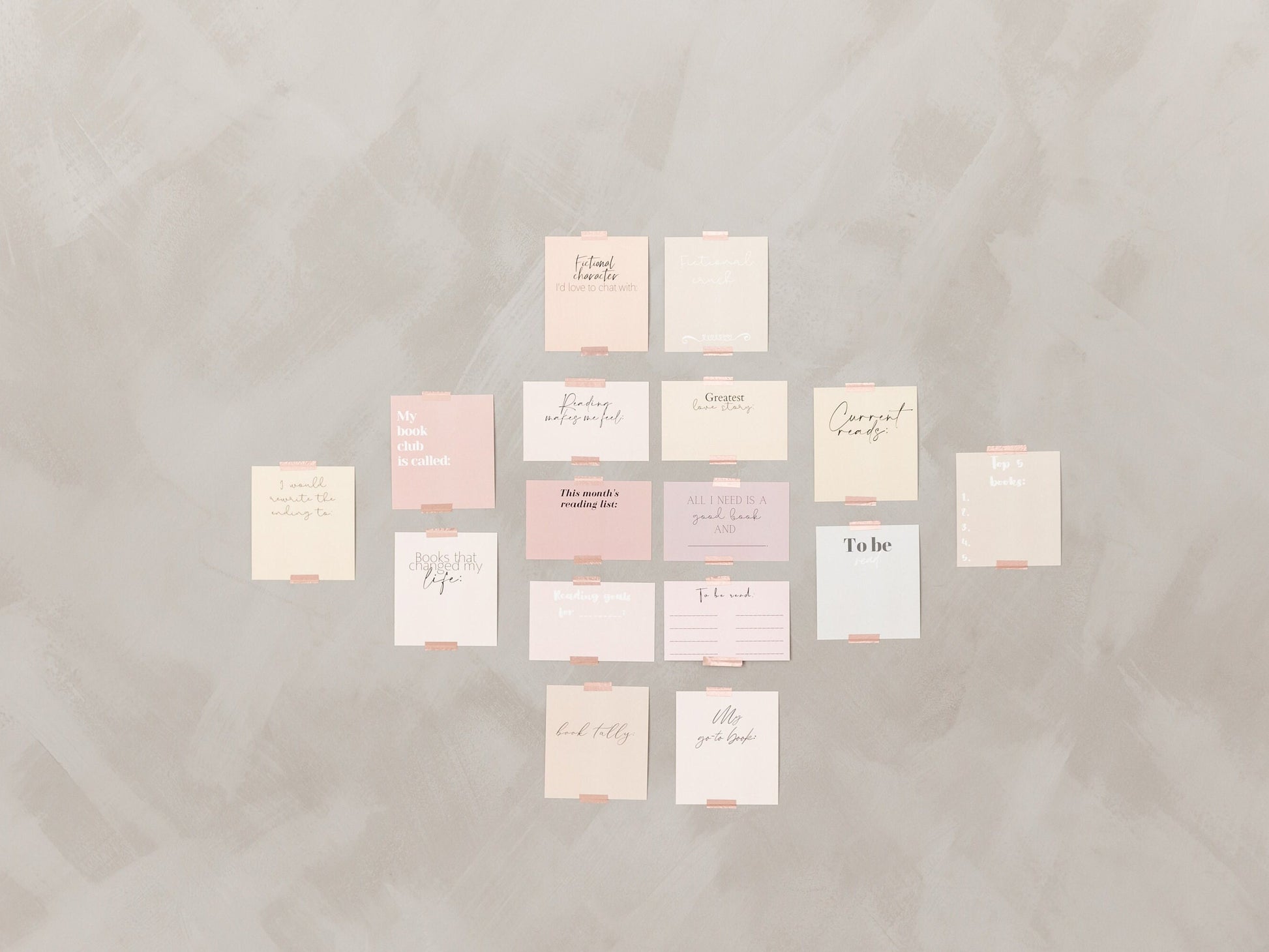 Full spread of reading tracker cards arranged on a soft neutral background