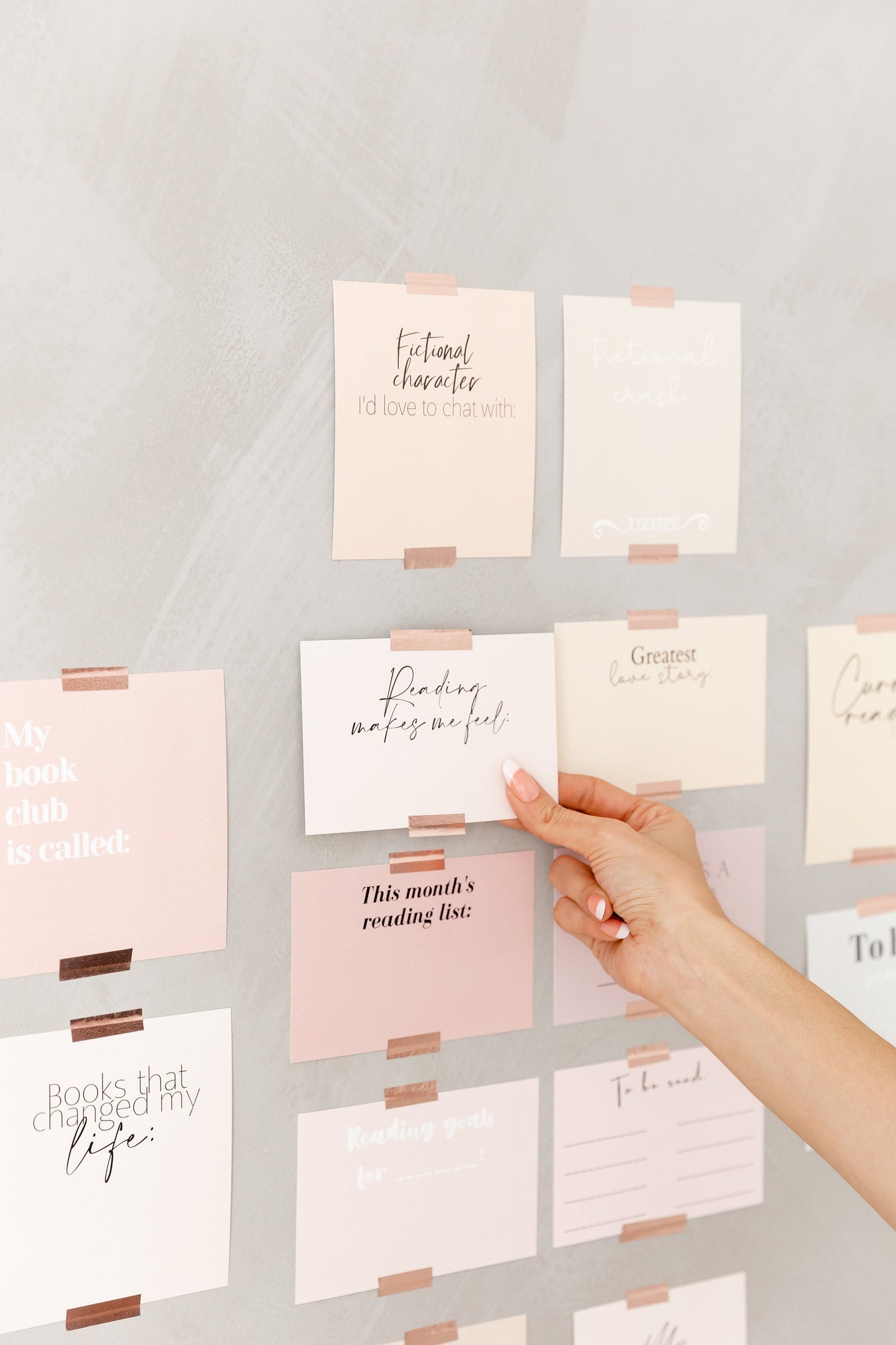Reading tracker cards displayed on a wall