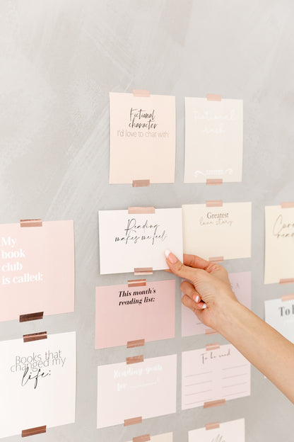 Reading tracker cards displayed on a wall
