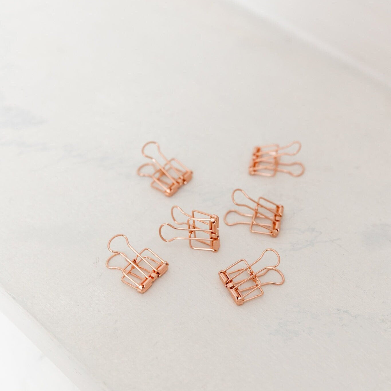 Set of 15 mini rose gold binder clips for vision boards and mood boards