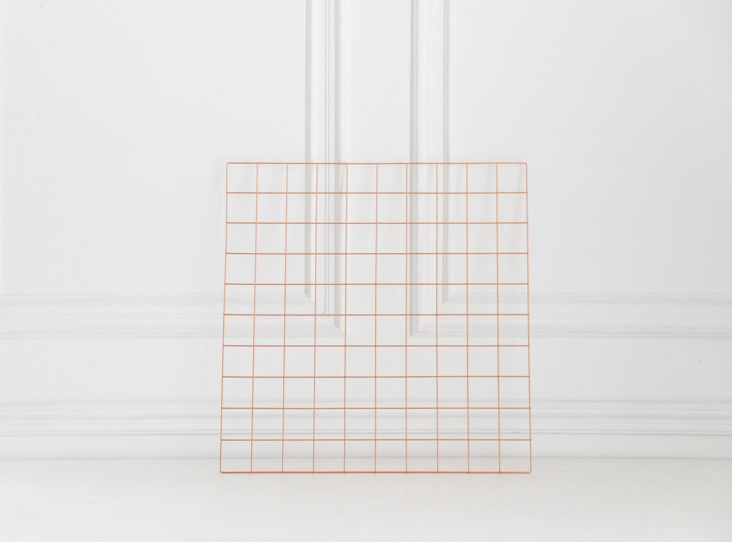 Rose gold wall grid shown on a clean white background