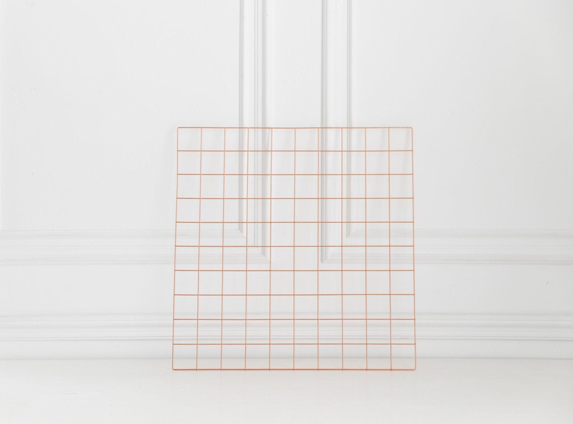 Rose gold wall grid shown on a clean white background