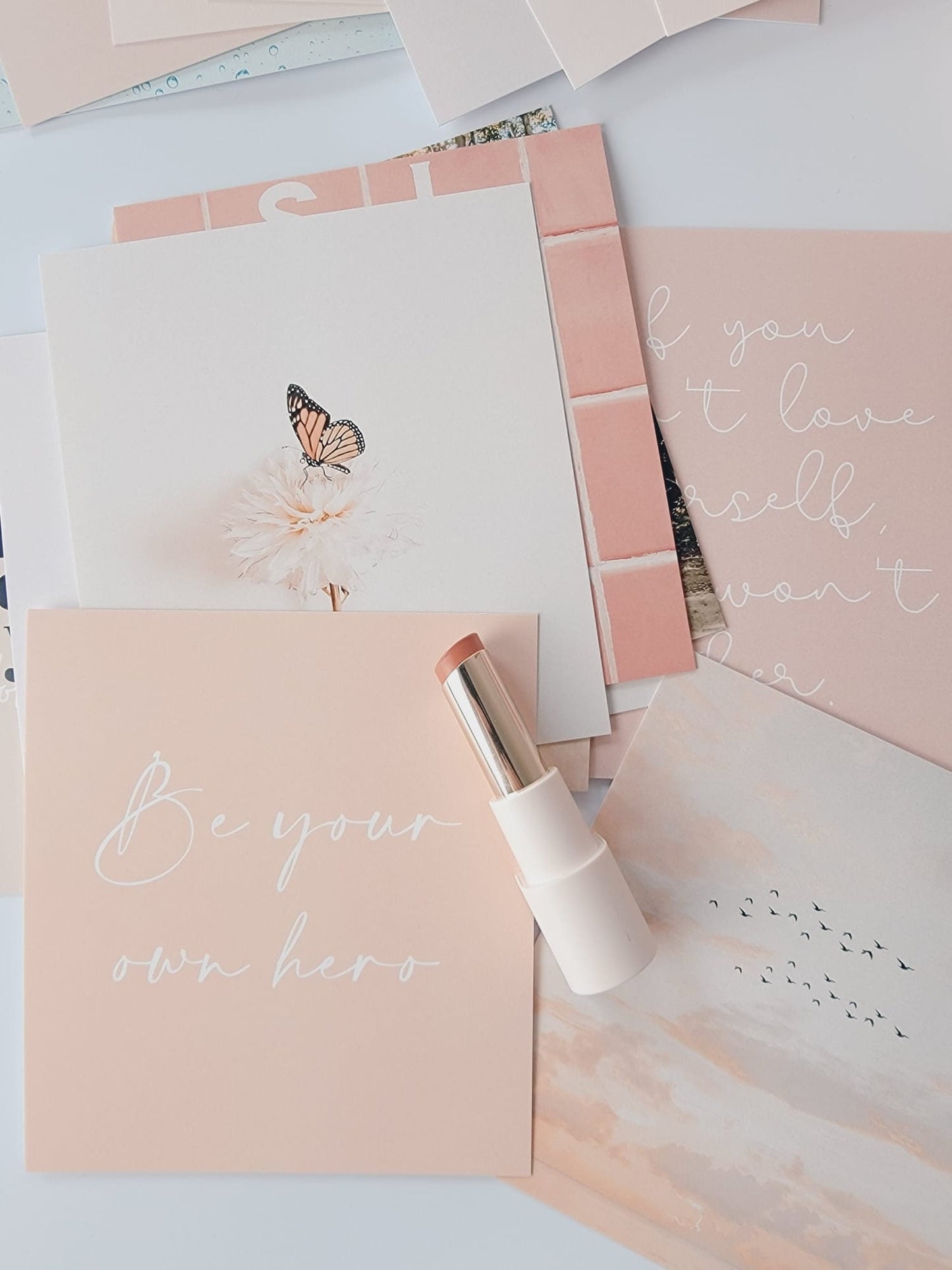 Self-love cards styled with a journal for affirmations and reflection