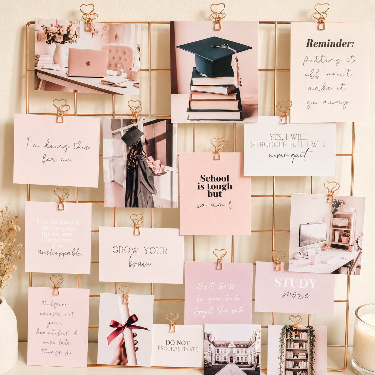 Study vision board close-up with motivation quote cards and heart clips on rose gold grid