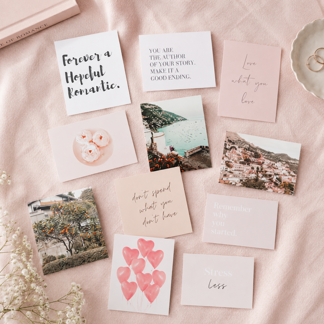 Vision board card starter set styled on soft pink fabric with quote cards and image cards