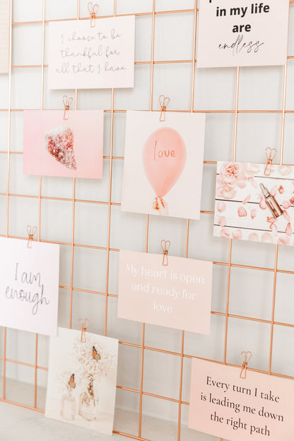 Wall grid styled with rose gold wire clips and inspirational cards
